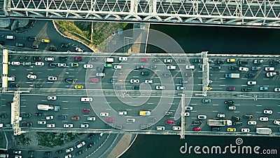 Aerial top down view of traffic jam on a car bridge and moving train Stock Photo