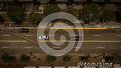 Aerial Top down view of vehicles driving down a city street Stock Photo