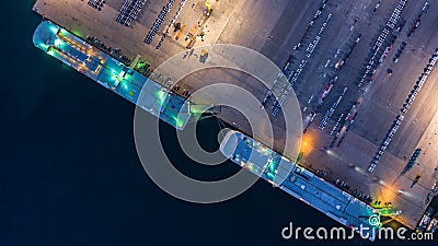 Aerial top view car carrier vessel at night, rows of new cars at night waiting to be dispatch and shipped import export new cars Stock Photo