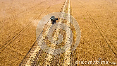 Aerial top view harvester machine working in fields Stock Photo