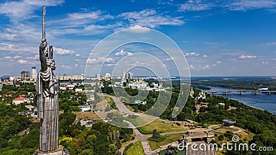 Aerial top view of Kiev Motherland statue monument on hills from above and cityscape, Kyiv, Ukraine Stock Photo