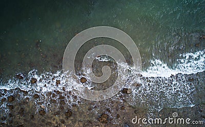 Aerial top view of ocean waves and Rock coast Stock Photo