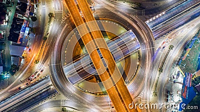 Aerial top view road roundabout intersection in the city at nigh Stock Photo