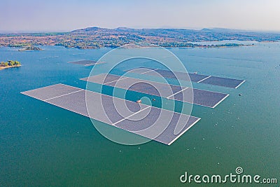 Aerial top view of solar panels or solar cells on buoy floating in lake sea or ocean. Power plant with water, renewable energy Stock Photo