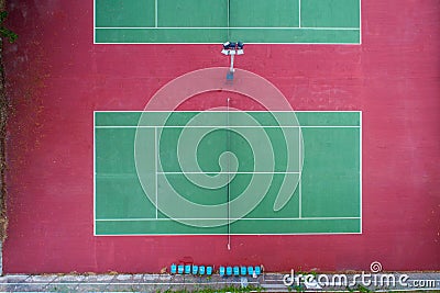 Aerial top view of the tennis court. Single and doubles player lines and areas. Empty field for athletes. Stock Photo