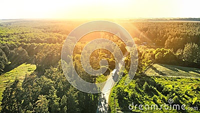 Aerial. Truck is driving along the country road. Stock Photo