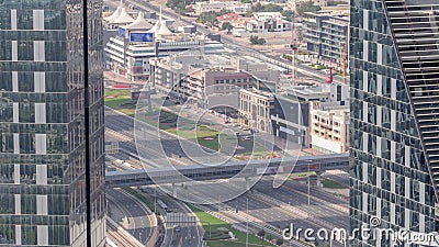 Aerial view from above to a busy road intersection in Dubai timelapse. Editorial Stock Photo