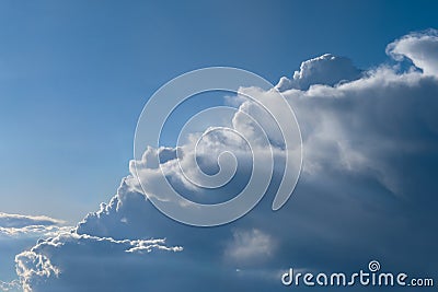 Aerial view from airplane of rain clouds and blue sky Stock Photo