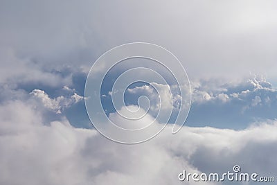 Aerial view from airplane of rain clouds and blue sky Stock Photo