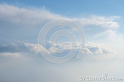 Aerial view from airplane of rain clouds and blue sky Stock Photo