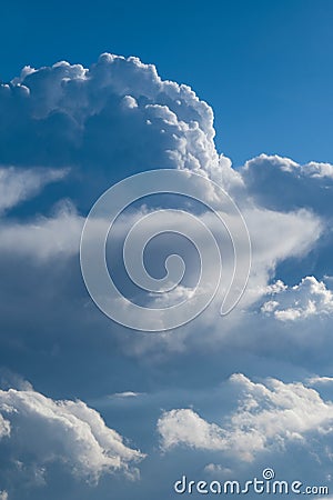 Aerial view from airplane of rain clouds and blue sky Stock Photo