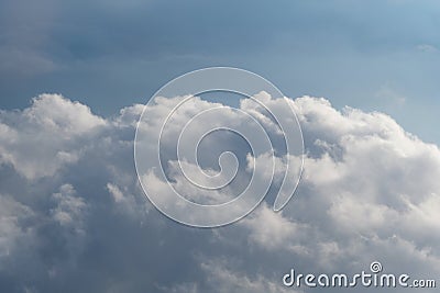 Aerial view from airplane of rain clouds and blue sky Stock Photo