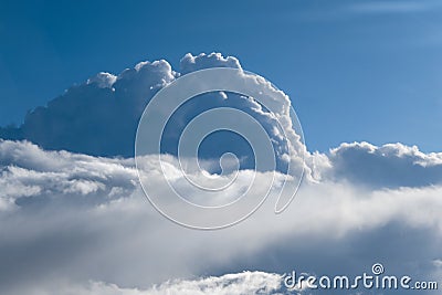 Aerial view from airplane of rain clouds and blue sky Stock Photo