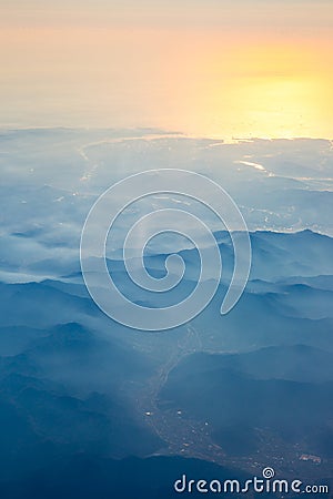 Aerial view from the an airplane at sunrise time Stock Photo