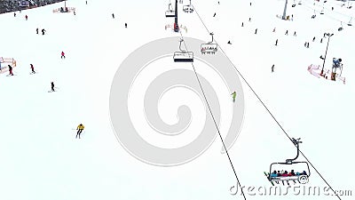 Aerial view of an alpine ski slope and chairlift in action Editorial Stock Photo