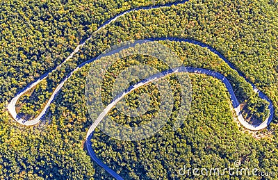 Amazing road curves in the forest mountain Scenic view of Sharp curve road by drone Stock Photo