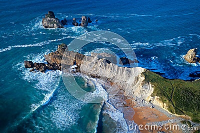 Aerial view of amazing rock formations on the Arnia beach, Spain Stock Photo