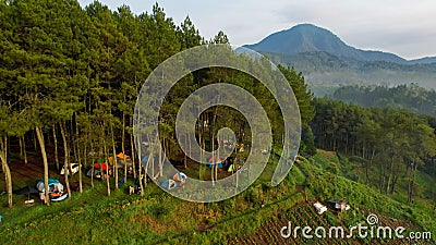 Aerial view of The atmosphere around the tent site of the Datar Pinus park. Lots of traveller are Camping at Datar Pinus Editorial Stock Photo