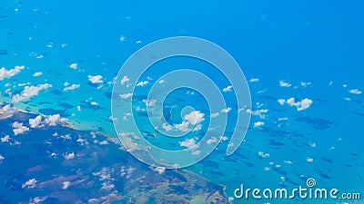 Aerial view of Bahamas shoreline under small clouds Stock Photo