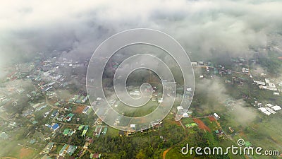 Aerial view of Bao Loc cityscape at morning with misty sky in Vietnam highlands Stock Photo