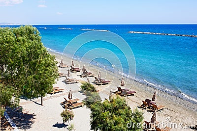 Aerial view on a beach chairs and umbrellas on sand beach. Stock Photo