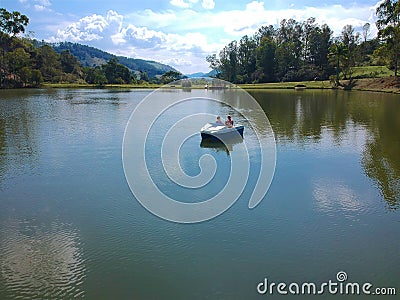 Aerial view of beautiful couple on the pedal boat on the lake in Brazil. Editorial Stock Photo