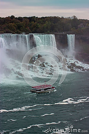 Aerial view of beautiful cruise ships with mesmerizing Niagara Falls waterfall in the background Editorial Stock Photo