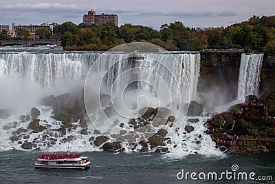 Aerial view of beautiful cruise ships with mesmerizing Niagara Falls waterfall in the background Editorial Stock Photo