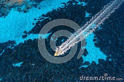 Aerial view of beautiful floating speed boat in blue sea Editorial Stock Photo