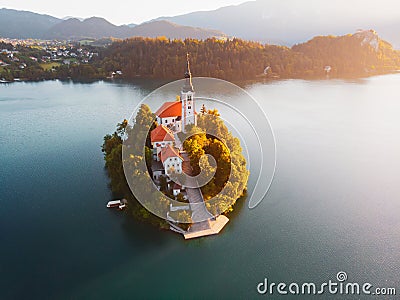 Aerial view of beautiful Lake Bled in the middle of the charming little island and the wonderful church at summer sunrise Stock Photo