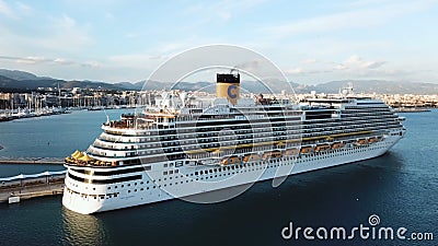 Aerial view of beautiful large white ship at sunset harbor. Stock. Landscape with boats, mountains, sea, blue sky Editorial Stock Photo