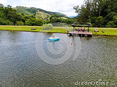 Aerial view of beautiful little wood cabana next the lake in tropical mountain, Editorial Stock Photo