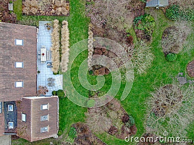 Aerial view of beautiful luxury villa with english garden type during winter season. Editorial Stock Photo