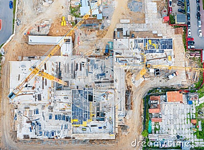 Aerial view of the beginning of the construction of the house, laying the foundation. Construction crane. View from above exactly Stock Photo