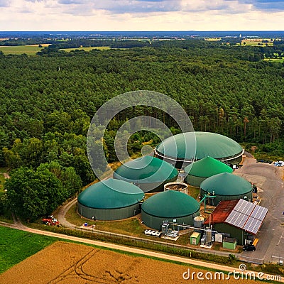 Aerial view of a biogas plant with silage piles and digesters for the production of methane gas Stock Photo