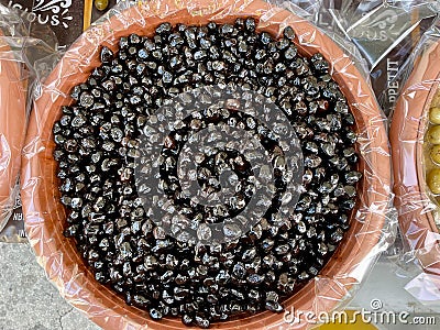 Aerial view of black olives at market stand in Domodossola, Italy. Stock Photo