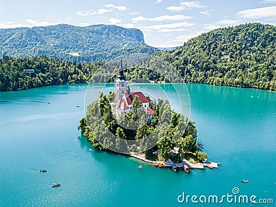 Aerial view of Bled Island or Blejski otok, Assumption of Mary church with a tower and spire, on mountain Bled lake, Slovenia. Stock Photo