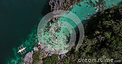 Aerial view of a boat at the turn to a small lagoon in which kay Stock Photo