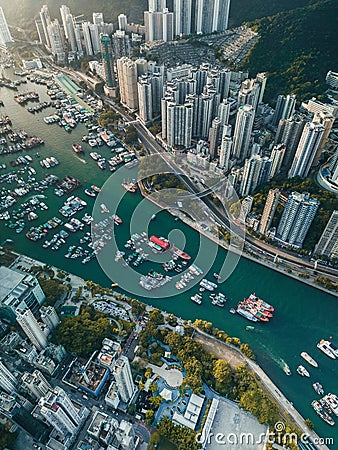 Aerial view of boats on the Aberdeen harbor near downtown buildings in Hong Kong Stock Photo