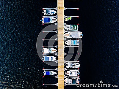 Aerial view of boats, yachts, water bike and wooden sauna in a marina in Finland Stock Photo