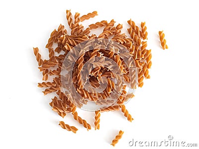Aerial view of Bunch of macaroni in the form of spirals Close up. Handful of wholemeal spelled fusili pasta isolated on white Stock Photo