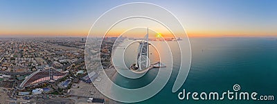 Aerial view of Burj Al Arab Jumeirah Island or boat building, Dubai Downtown skyline, United Arab Emirates or UAE. Financial Editorial Stock Photo