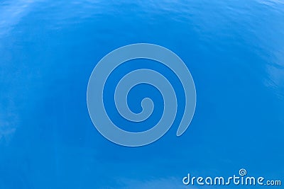 Aerial view of calm turquoise sea water. Beautiful top view of clean Indian ocean water. Rays play on blue weater. Top view. Stock Photo