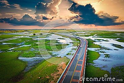Aerial view of Chalerm Phra Kiat road at sunset in Thale Noi, Phatthalung, Thailand Stock Photo