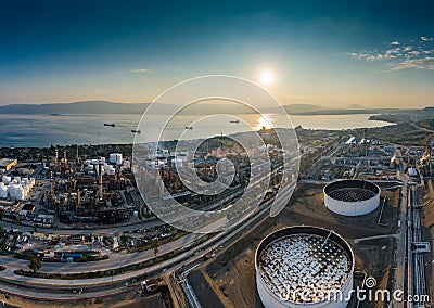 Aerial view of Chemical plant at sunset, oil refining, smoke, pipes, ecology pollution, air infection, coast of sea in Stock Photo