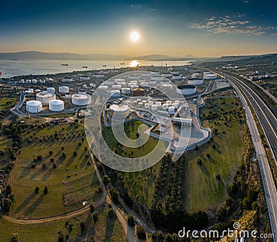 Aerial view of Chemical plant at sunset, oil refining, smoke, pipes, ecology pollution, air infection, coast of sea in Stock Photo