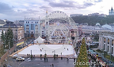 Aerial view of Christmas market Kyiv, Ukraine. Ferris wheel, ice rink, Christmas tree and decoration at Kontraktova square Stock Photo