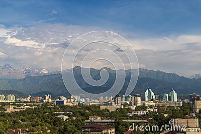 Aerial view of the city of Almaty immersed in greenery at the foot of the Zailiysky Alatau mountains Editorial Stock Photo