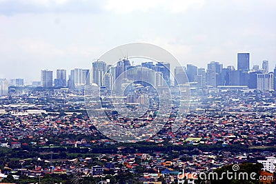 An aerial view of commercial and residential buildings and establishments in the towns of Cainta, Taytay, Pasig, Makati and Taguig Editorial Stock Photo