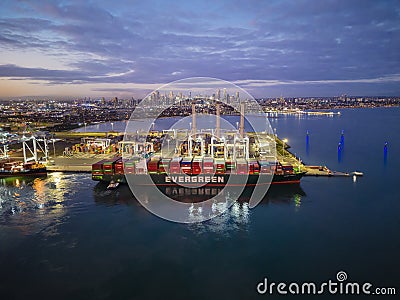 Aerial view of container ship arriving at Port of Melbourne at sunset Editorial Stock Photo